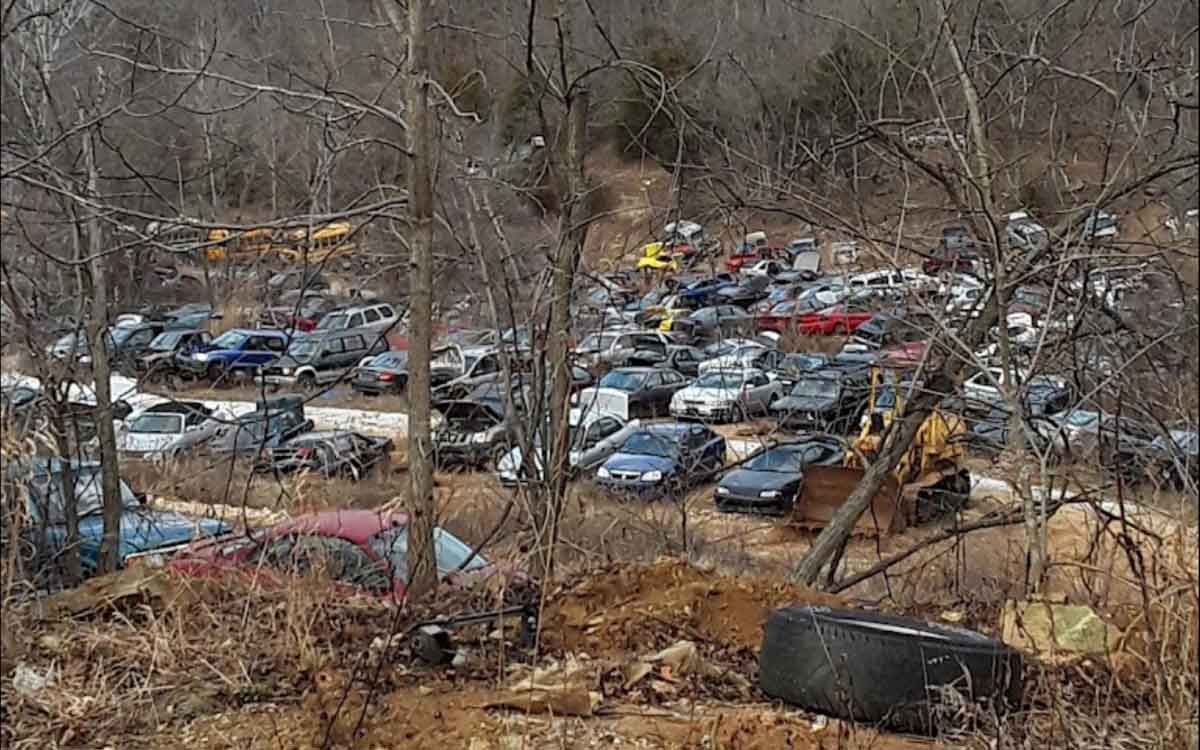 Junked vehicles at Fenton Auto Salvage yard at 6650 Treasure Dr, House Springs, MO 63051