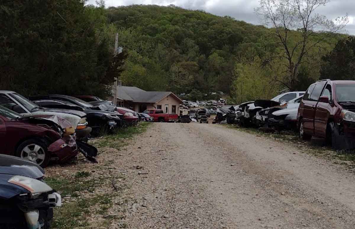 Junked vehicles at Fenton Auto Salvage yard at 6650 Treasure Dr, House Springs, MO 63051