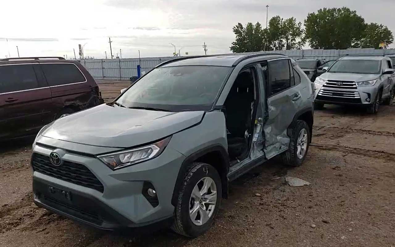 Toyota RAV4 with side damage at the junkyard