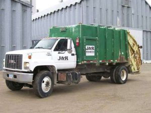 J R Sanitation LLC at 303 Hickory St Garrison IA 52229 4 300x224